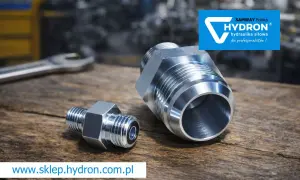 Dwa metalowe nypelki hydrauliczne Hydron na drewnianym blacie. Jeden mniejszy, drugi większy, gotowe do montażu.