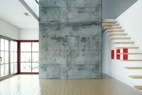 Nowoczesne wnętrze z betonem zbrojonym włóknem szklanym, drewnianymi schodami i dużymi oknami.
